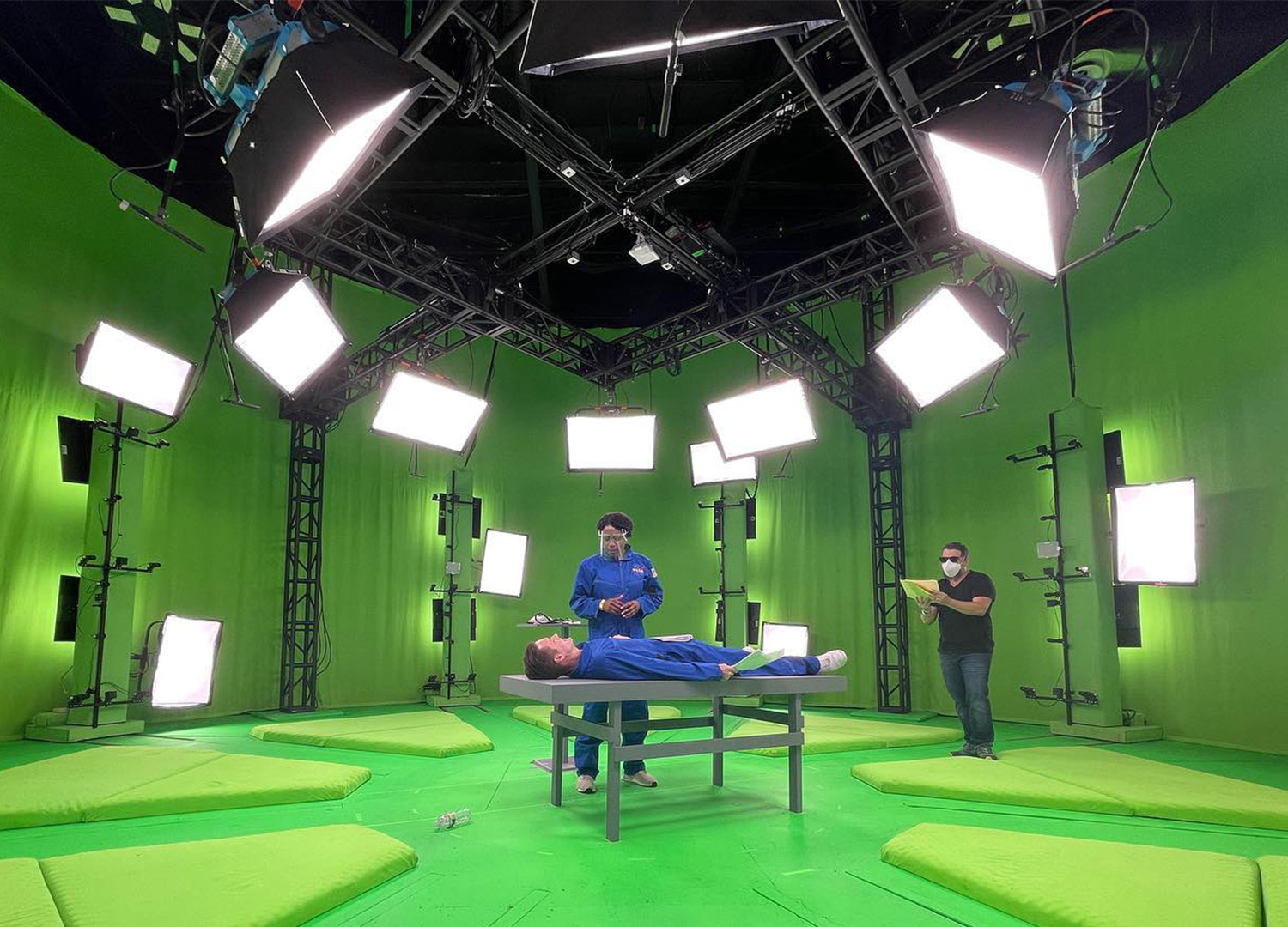 Two actors portray astronauts on volumetric capture stage for a virtual reality training app.